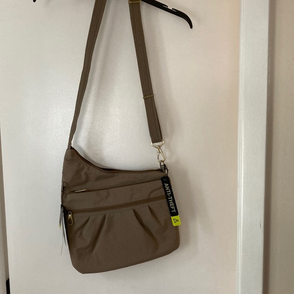 Travelon Handbags - NWT Travelon brand cross body purse